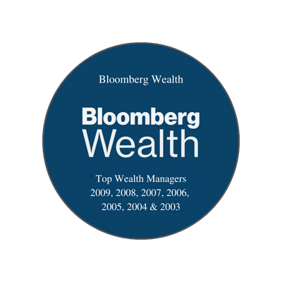 This image is an **award badge from Bloomberg Wealth**. It recognizes honorees as **“Top Wealth Managers”** for the years: **2009, 2008, 2007, 2006, 2005, 2004, and 2003**. The badge is circular with a **navy-blue background**, featuring the **Bloomberg Wealth logo** prominently in the center, with the award details listed below. This recognition highlights sustained excellence in wealth management over multiple consecutive years.