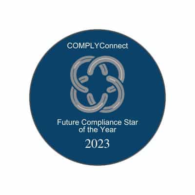 This image is a 2023 award badge from COMPLYConnect. It features a navy-blue circle with a silver interlocking chain design in the center. The text reads: "COMPLYConnect – Future Compliance Star of the Year – 2023". This badge represents recognition for excellence and promise in the field of compliance.