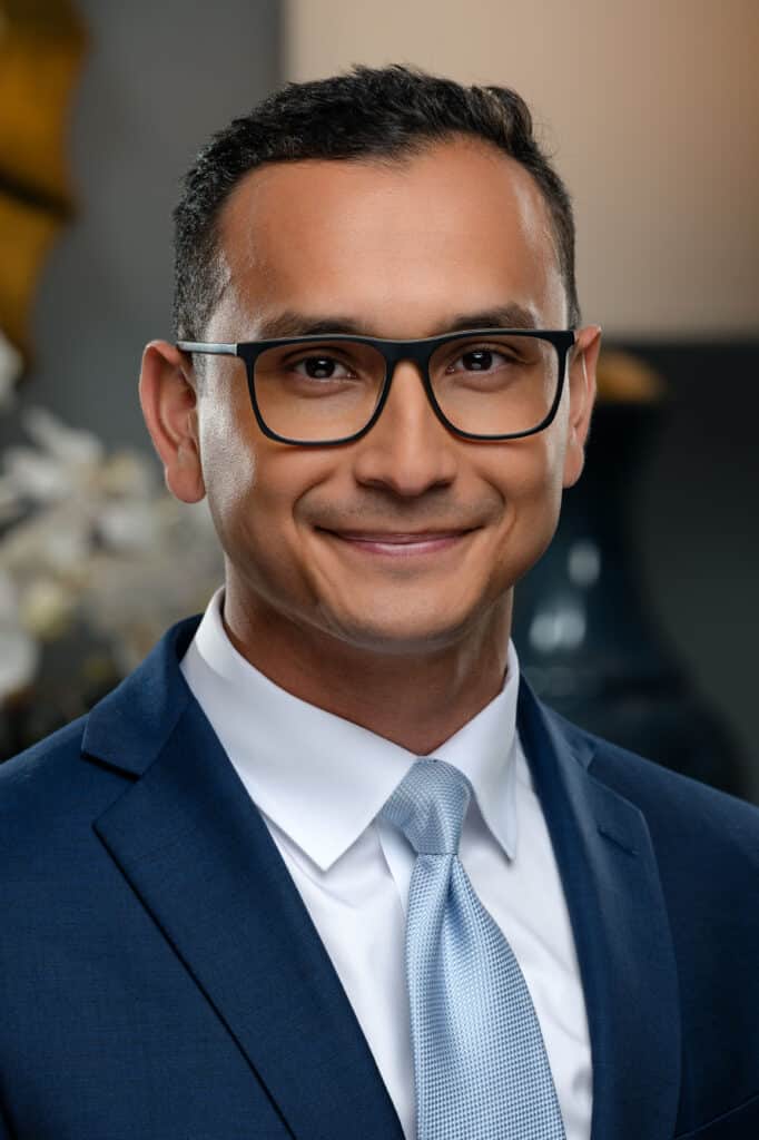 Professional headshot of Alexx V. Peralta, Financial Advisor at Retirement Investment Advisors, Inc.